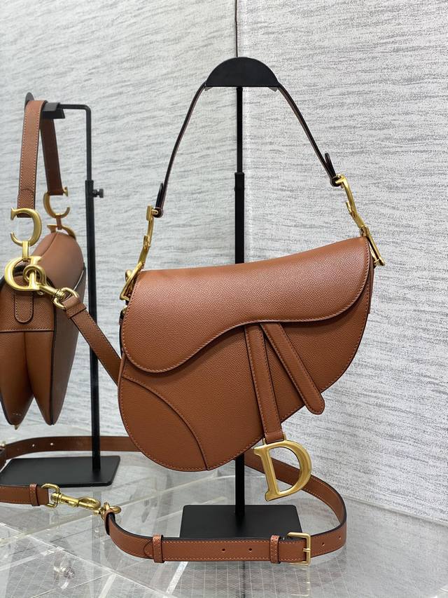 Caramel-colored large long shoulder strap classic saddle bag. The king of kings