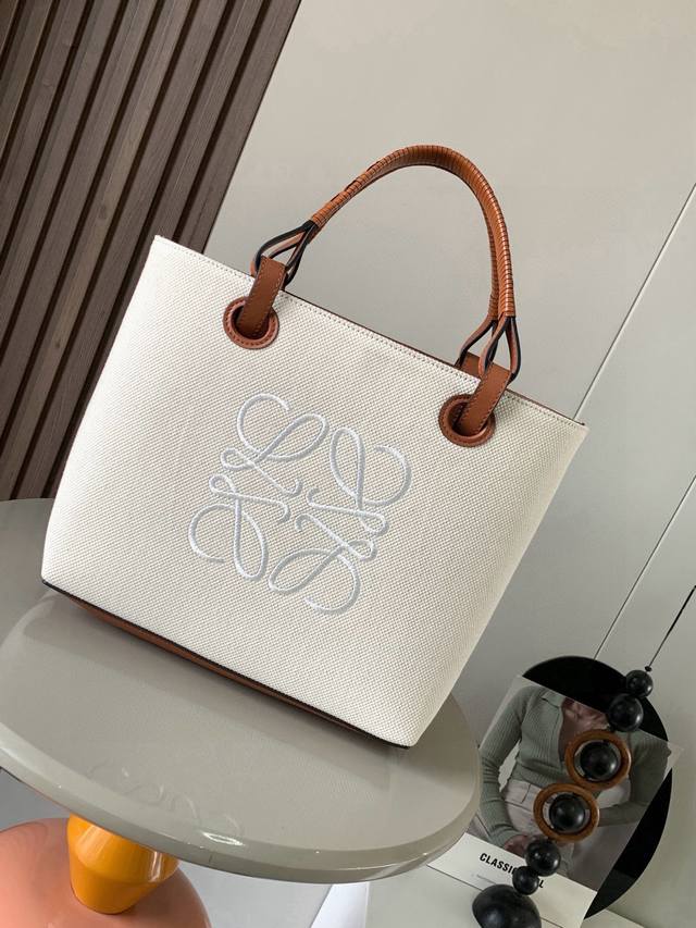Medium-sized Calfskin Leather Anagram Tote Handbag with Linen Patchwork Handle.