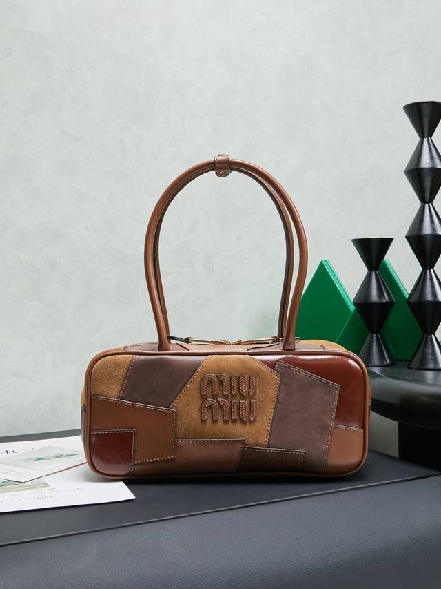 5Bb147: Miu's new patchwork bowling bag, handcrafted from various leathers, feat