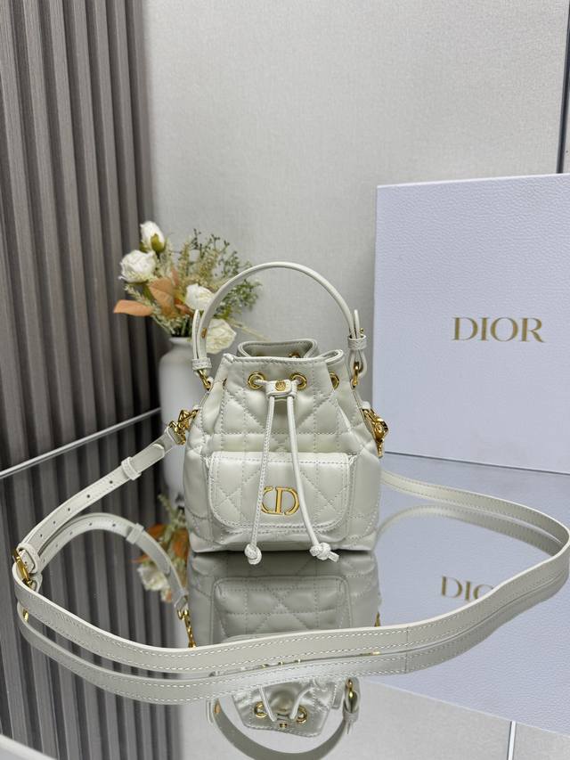 Authentic, High-Quality This mini Dior Caro bucket bag is a new addition to the