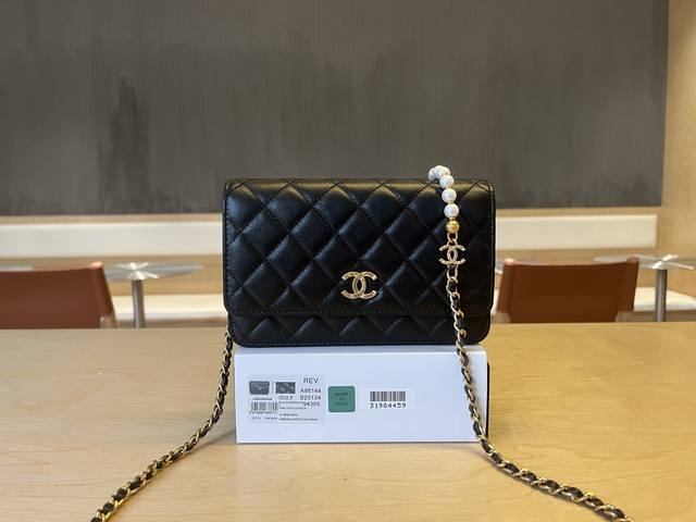 A96144 Chanel 25S Pearl Chain Bag. The chain features 7 sparkling pearls that ar