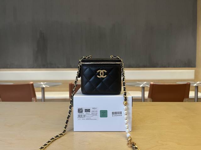 A96145 Chanel 25S Pearl Chain Lipstick Bag. Seven pearls on the chain sparkle br