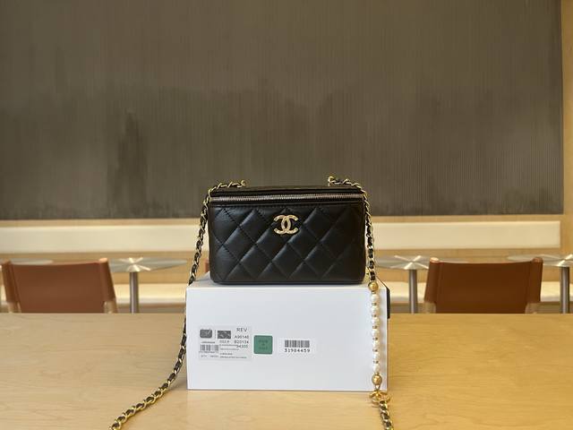 A96146 Chanel 25S Pearl Chain Lipstick Bag. Seven pearls on the chain sparkle br