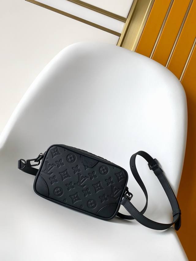 M26737 This black embossed Trocad