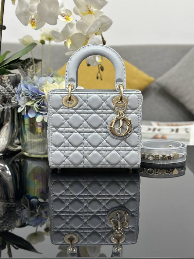 Lady Dior four-compartment lambskin monogram handbag with cannage pattern. Featu