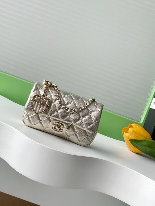 25A Mini Heart Pearl CF Charm Small Leather Goods. The charm of Chanel's M