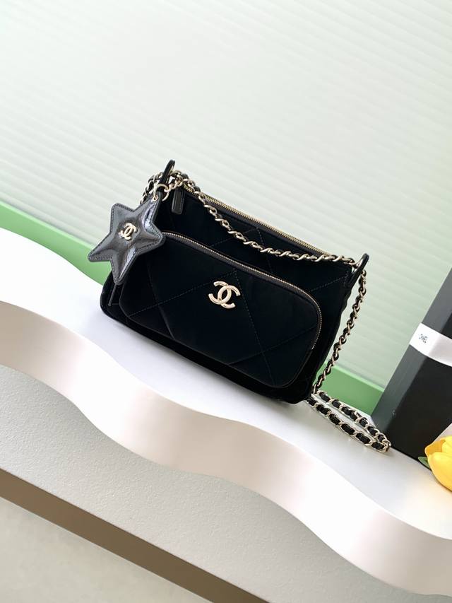 Chanel 25N Ski Capsule Collection Star Bag Features a star charm, black quilted