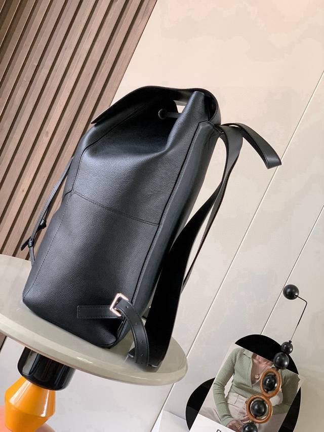 puzzle Backpack This military-style backpack is made of soft grained calfskin le