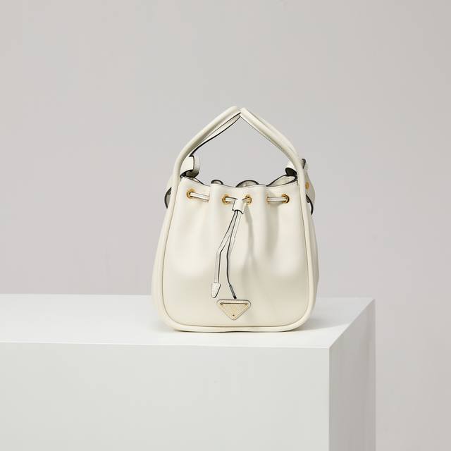 Premium Original New Bucket Bag 1Be087 White. This bucket bag is made of exquis
