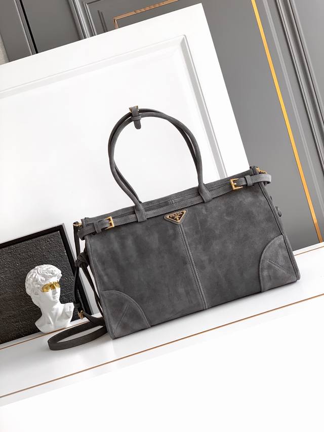 handbag/crossbody bag is made of imported suede leather with a glossy finish th