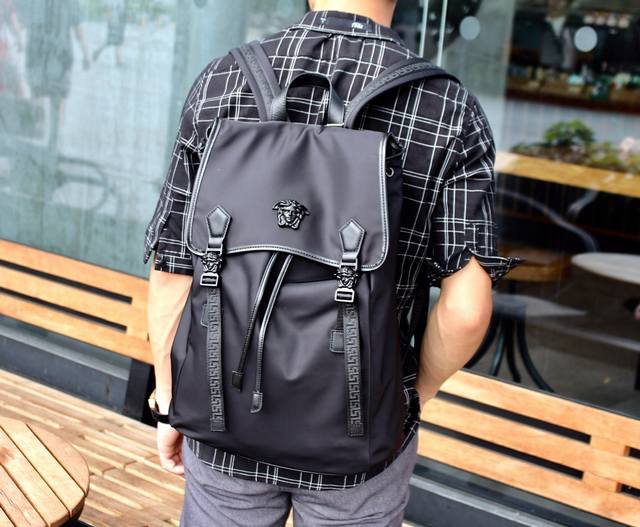 Model: 689-1 Black Buckle Original Backpack, a backpack featuring the iconic "S