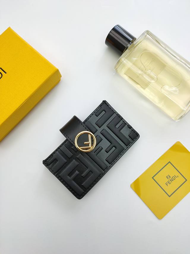 Fendi F Is Fendi flat card holder with a middle compartment and five card slots