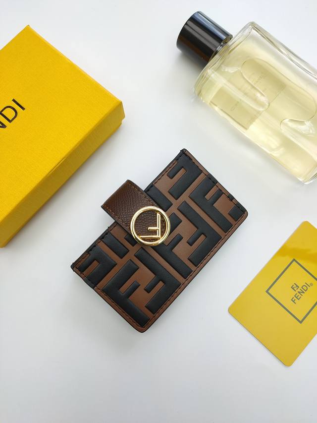 Fendi F Is Fendi flat card holder with a middle compartment and five card slots