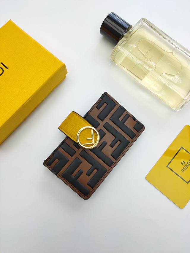 Fendi F Is Fendi flat card holder with a middle compartment and five card slots