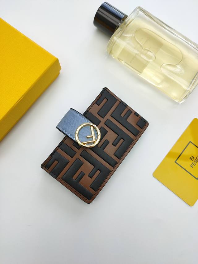 Fendi F Is Fendi flat card holder with a middle compartment and five card slots