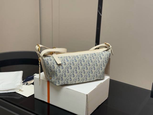 Canvas, cowhide, and box included Size: 28.13cm Dior's new Hobo bag sneak peek