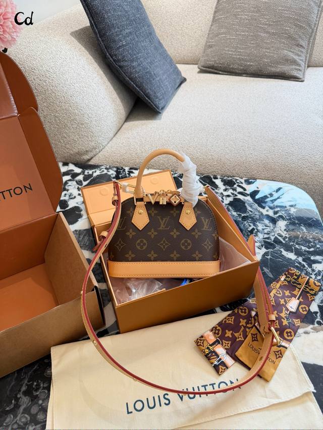 LV Alma Bb Monogram Canvas Shell Bag The LV Alma Bb shell bag features classic M