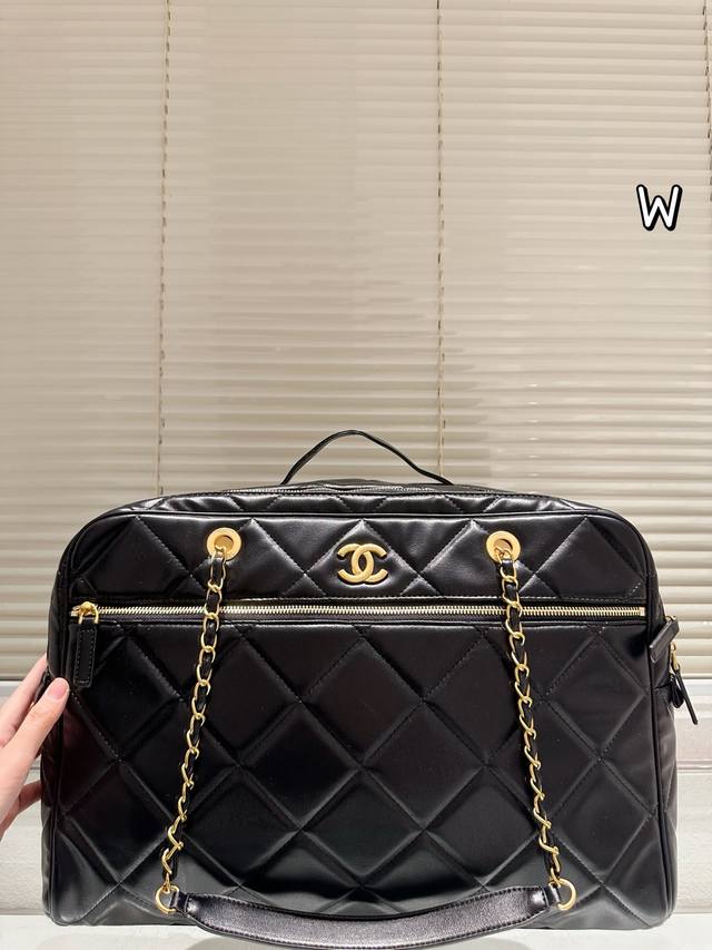 Chanel Black and Gold Quilted Travel Bag This Chanel black and gold quilted came