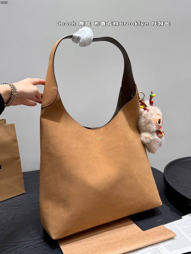 Comes with a box Pairs with a Christmas fabric charm Coach Brooklyn 28 Tote Bag