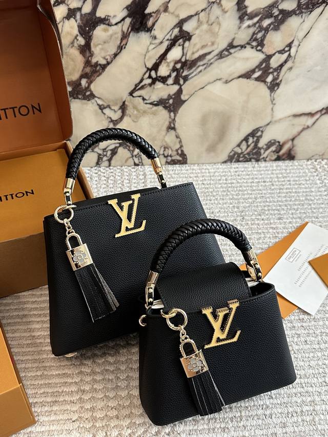 Folding Box Capucines luxury handbag with gold-plated hardware, featuring an ex