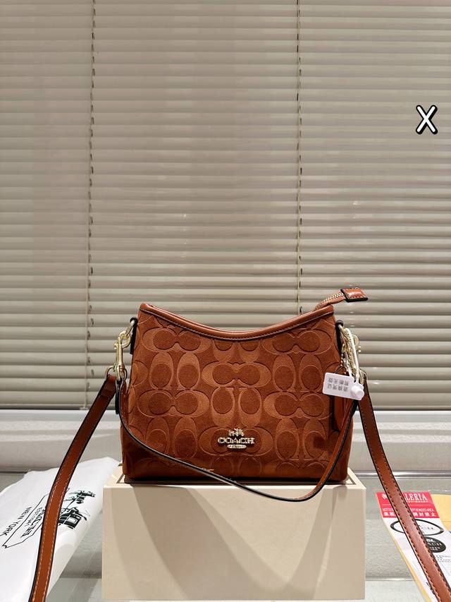 Coach | Laurel Hobo Bag Coach's classic moon bag, slightly larger than a shoulde