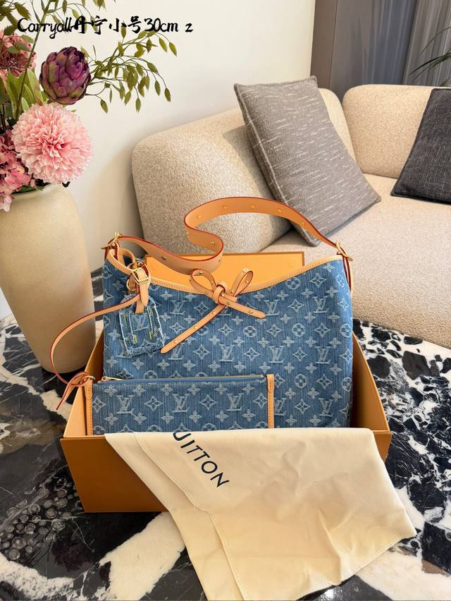 LV Denim Carryall This isn't a plant or animal, but a fashion item