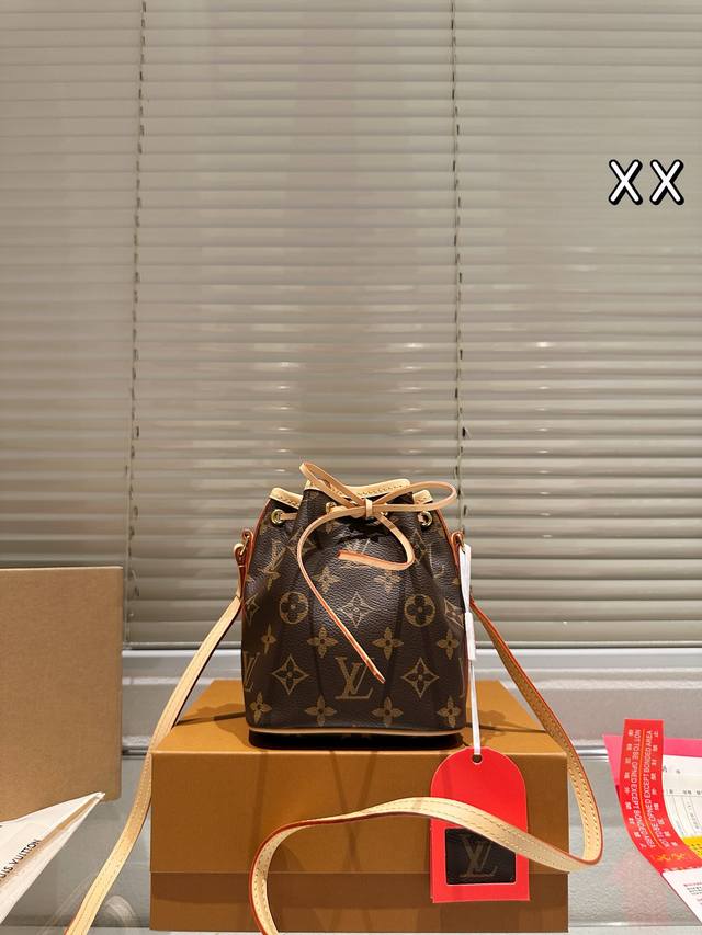 Comes with a folding box/airplane box. Size: 14*16cm. New Lv Nano Bucket Bag. J