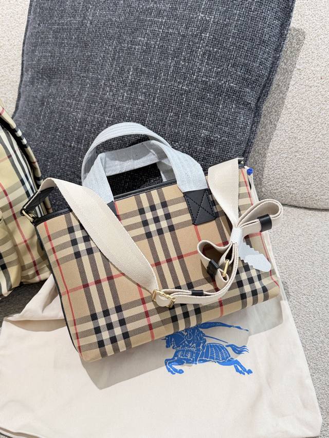 Burberry's latest check mini tote bag, crafted from cotton canvas, features a c