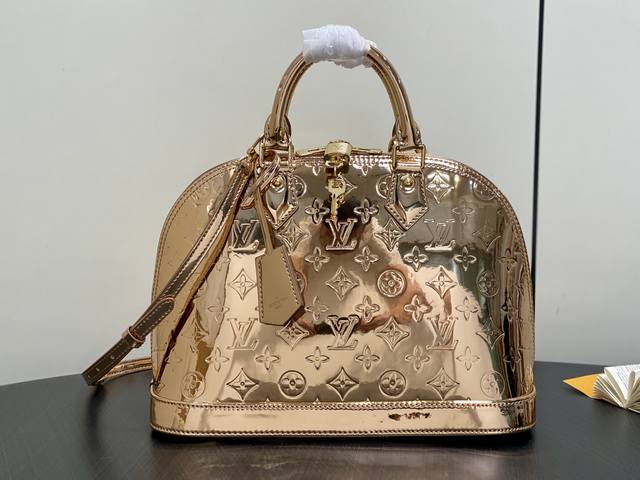 Original Quality M27037 Gold Mirror Patent Leather Medium Shell Bag. This Alma m