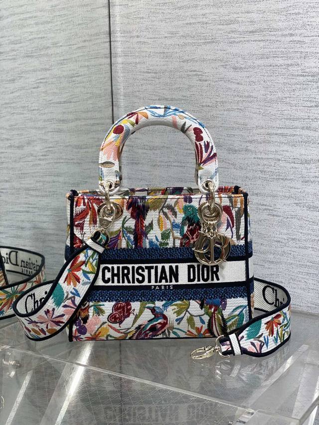 Dior Lady Dior in stock. Featuring embroidered colorful butterflies, this bag b