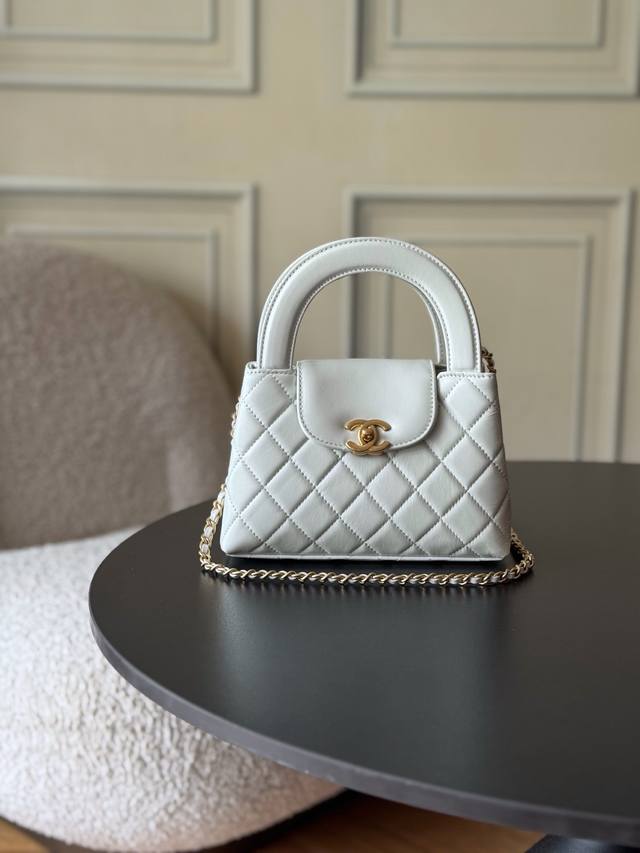 24A Kelly Handle Bag, White. Fashion is cyclical; the highly sought-after vintag