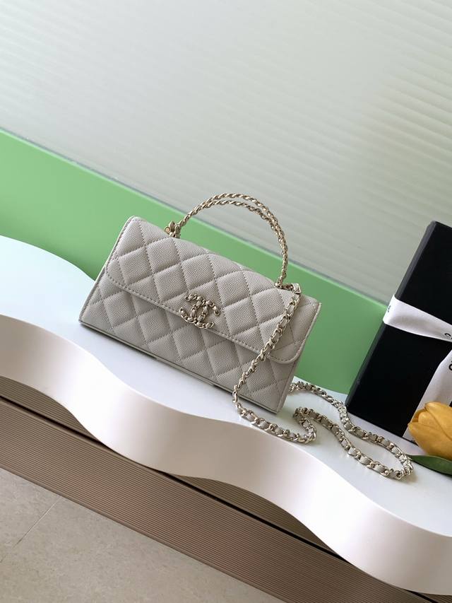 25A This large, horizontal, flip-top leather bag features a retro yet stylish de