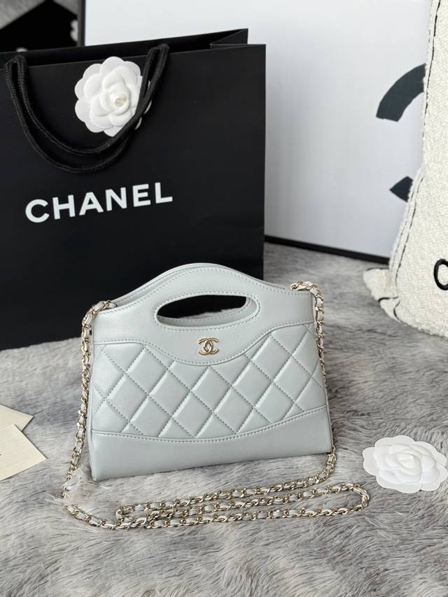 Light blue and light gold 24B's 31Bag Nano! Mini size, made of waxed lambskin,