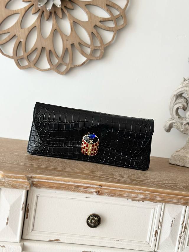 Vintage crocodile-embossed Chanel black crocodile-embossed clutch/evening bag.