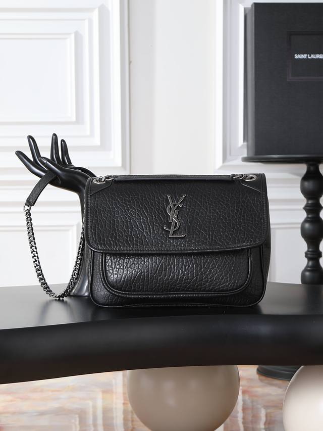 Black elephant print with silver hardware, 28cm. The Niki bag is incredibly coo