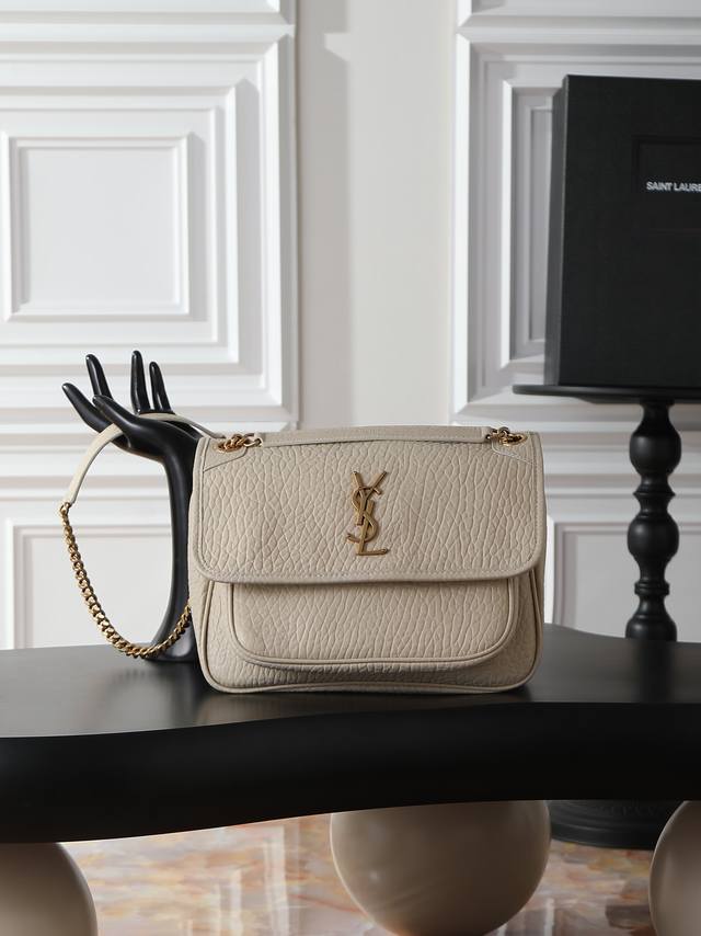 White elephant print with gold hardware, 28cm. The Niki bag is incredibly cool!