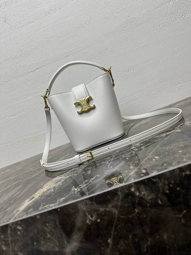 Authentic Louise Mini Bucket Bag. This mini handbag can fit a large smartphone (