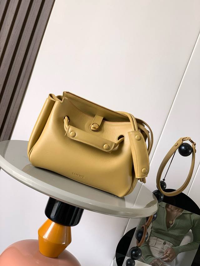 Original Leather Small Soft Calfskin Madrid Handbag. The Madrid features a soft,