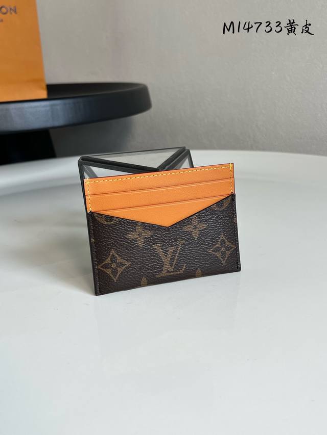Chip version M14733 Triple Card Holder is crafted from Monogram coated canvas,
