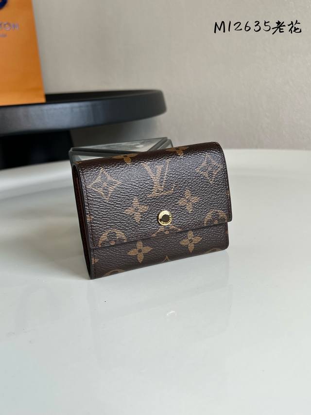 Chip Version M12635 Monogram Victor Wallet. This compact Victor wallet is craft