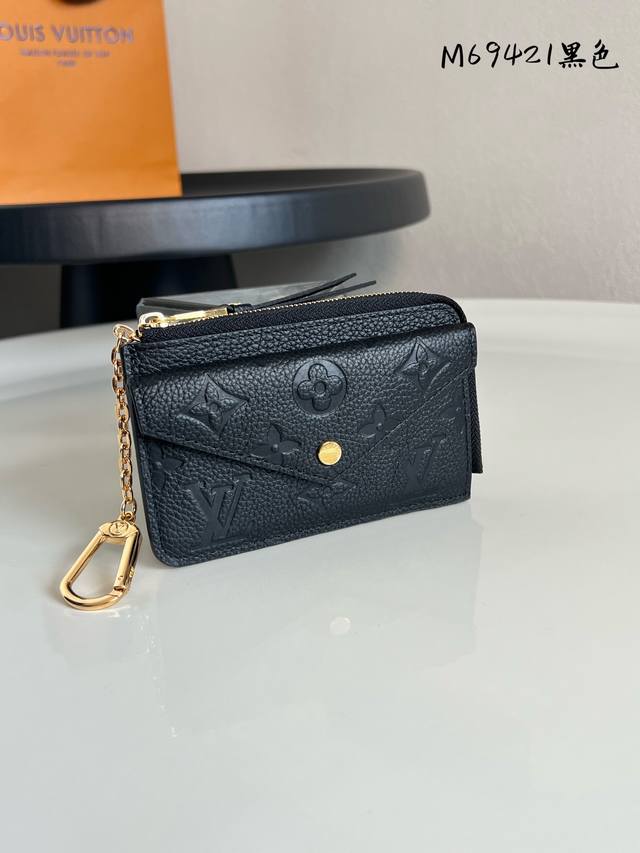 Chip-enabled M69421 Black Recto Verso Card Holder is crafted from Monogram Empr