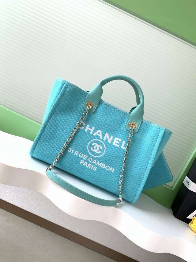 Chanel Beach Bag Shopping Bag. Made of cotton, this large bag combines calfskin