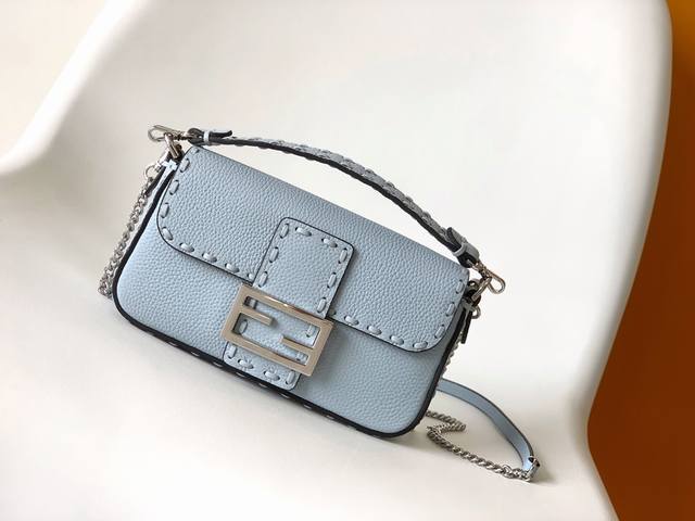 Authentic Light Blue Small Baguette Bag, made of pebbled calfskin leather with l