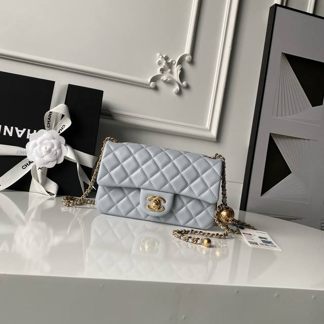 Chanel's popular metal CF Mini flap bag As1787. The addition of a small gold bal