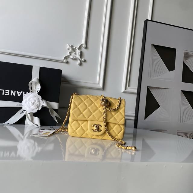 Chanel's popular metal CF Mini flap bag with gold ball As1786. The small gold ba