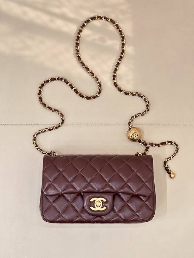 1787 The large Mini bag is incredibly substantial in person. The little gold bal