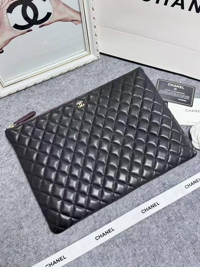 Special Price Chanel iPad Clutch. Made of imported French lambskin, simple yet e
