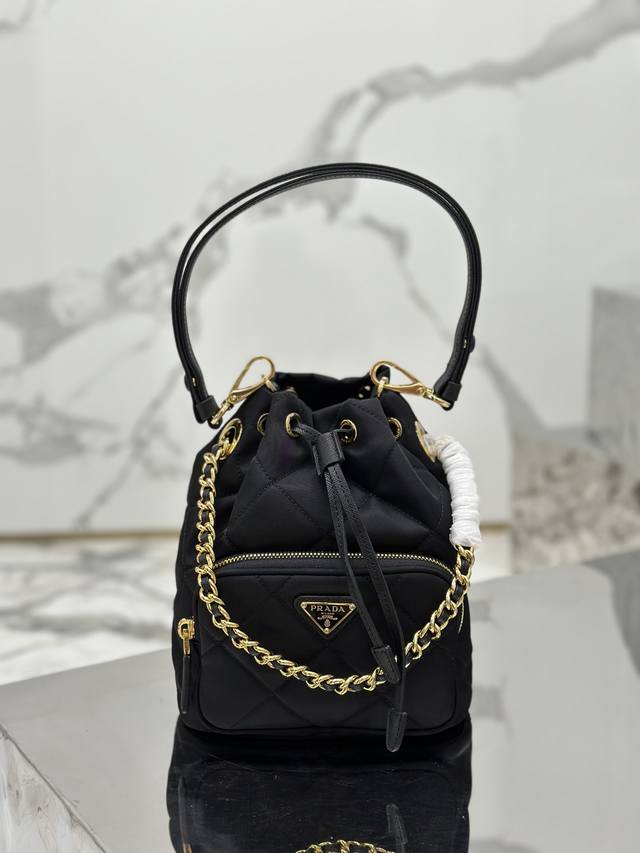 Authentic Quilted Bucket Bag. This versatile Re-Nylon shoulder bag features a pa
