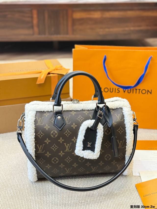 Reissued Leather LV Ski Series Speedy 30 Plush Bag. Featuring classic Monogram c