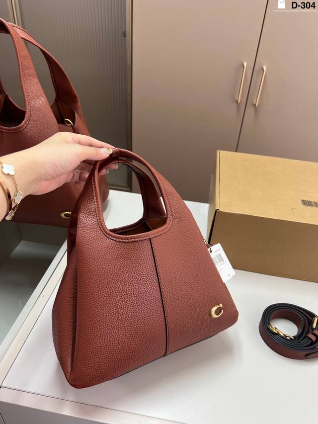 Coach Lana Basket, September New Arrival. Features a small magnetic closure com